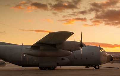 military aircraft image at sundown